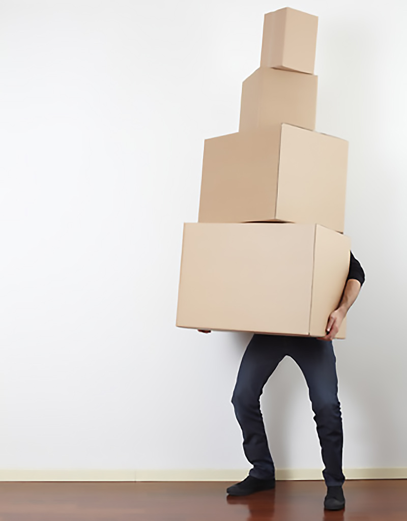 man-lifting-cardboard-boxes-in-apartment-moving-day-800